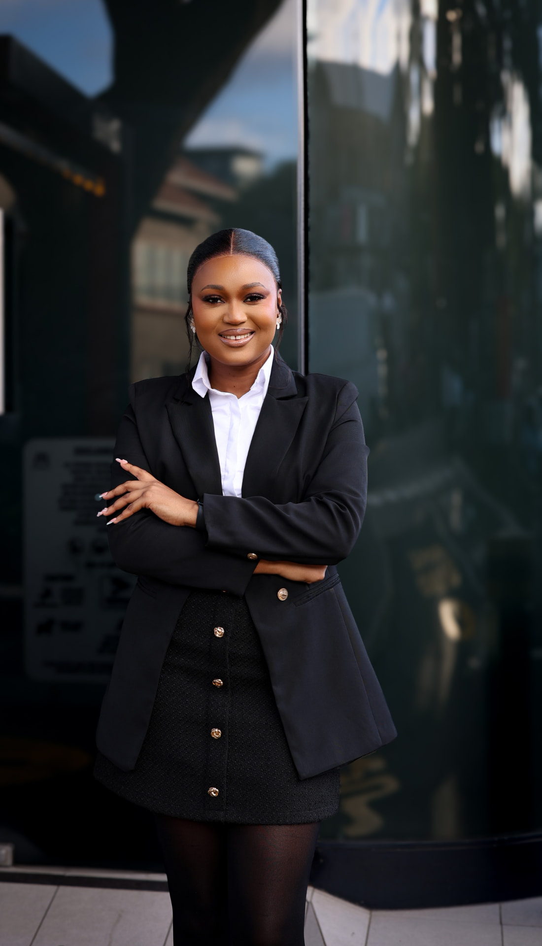 Thandeka Ngwenya, founder of Iwundlu Accounting Consultants, smiling outside a building